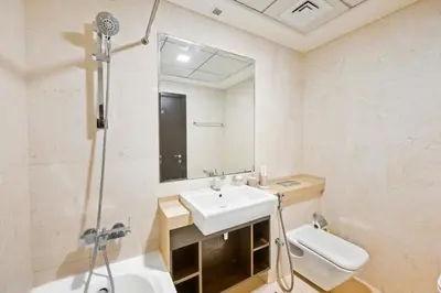 a bathroom with a sink and a shower at Serene Escape in Bustling Marina and JBR, Ensuite 2BR, Sky Garden Access in Dubai