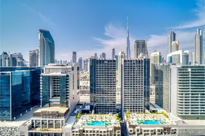 a view of a large city with many buildings at Reva Residence - Luxe 1BR with Burj Khalifa View in Dubai