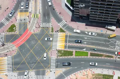 an overhead view of a busy city intersection with cars at Livbnb - Scenic 2BHK with Amazing Marina Views in Dubai