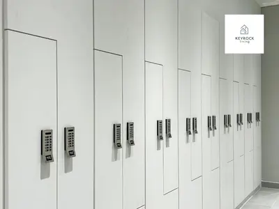 a row of white lockers in a room at KeyRock Living - Zada 1BR with Pool & Gym Access in Dubai