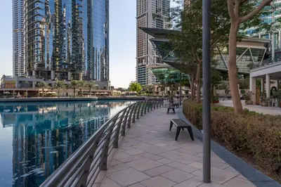 a swimming pool in a city with tall buildings at Frank Porter - Lake Terrace Tower in Dubai