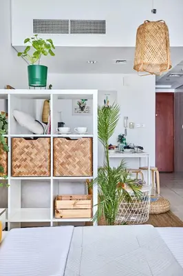 a room with plants and white shelving at Frank Porter - Lake Terrace Tower in Dubai