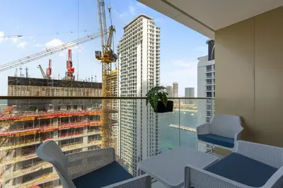 a balcony with a view of a tall building at Coastal Elegance 1-Bedroom in Grand Bleu in Dubai