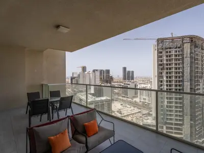 a balcony with a view of a city at Spacious and Cozy 1BDR in Hameni in Dubai