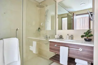 a bathroom with a shower and a sink at Frank Porter - Palm View in Dubai