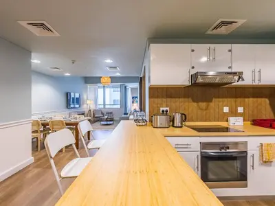 a kitchen with a wooden counter top in a room at Stylish 1-Bedroom with Panoramic Partial Sea View in Dubai