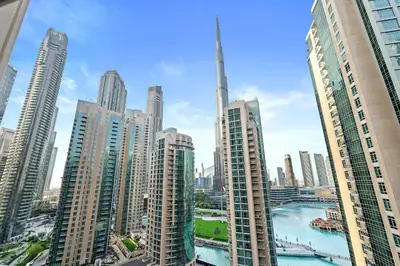 a view of a city skyline with tall buildings at 2BR in Downtown with Burj Khalifa & Fountain views in Dubai