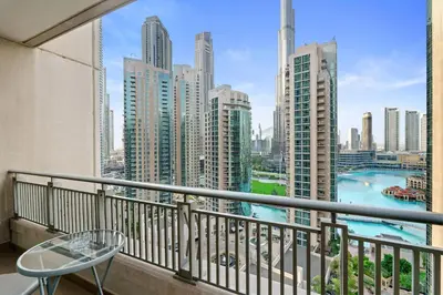 a balcony with a view of a city at 2BR in Downtown with Burj Khalifa & Fountain views in Dubai