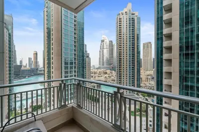 a balcony with a view of the city at 2BR in Downtown with Burj Khalifa & Fountain views in Dubai