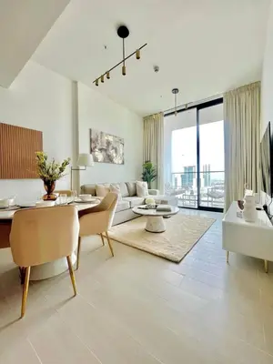 a living room with a couch and a table at Stylish 1br In Jvc Balcony, Pool & Free Parking in Dubai