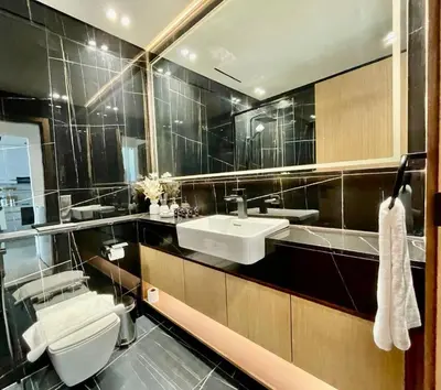 a bathroom with a sink and a toilet at Bright 1br Jvc Balcony & Free Parking in Dubai