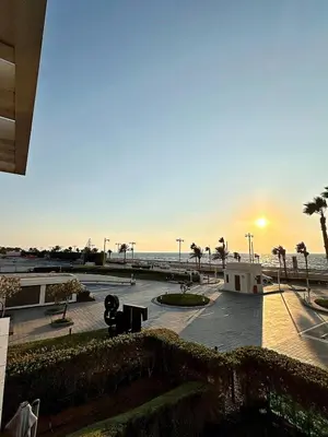 a skate park at the beach with the sunset in the background at AURA -Direct Seafront 2BR-Palm in Dubai