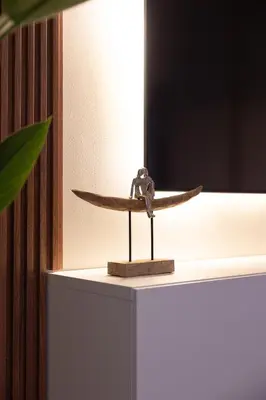 a wooden surfboard on top of a table at Luxe 2BR Dubai Retreat with Ain Dubai View for 6 guests in Dubai