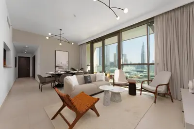 a living room with a couch and chairs and a table at Elite Escape - 3 BHK Burj View & Dubai Mall Access in Dubai