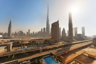 a view of a city with a bridge and buildings at Elite Escape - 3 BHK Burj View & Dubai Mall Access in Dubai