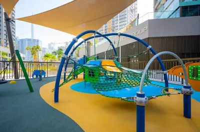 a playground in a building with a slide at High Floor Burj and Canal View Business Bay in Dubai