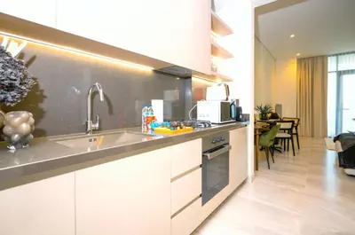 a kitchen with a sink and a counter top at High Floor Burj and Canal View Business Bay in Dubai