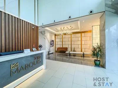 a lobby of a manolisolis store with a lost and stay sign on at Boho-Chic Comfort - 1BR Haven - Marquis 2020 Arjan in Dubai