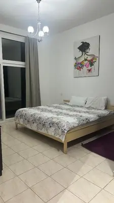 a bedroom with a bed in a room at RKOkeys in Dubai