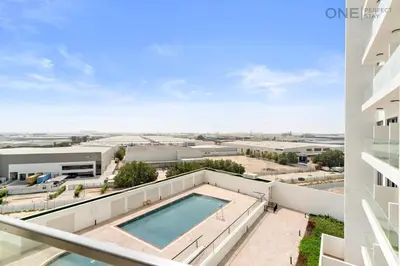 an image of a swimming pool on the balcony of a building at 1BR with Balcony Near Metro Station in Dubai