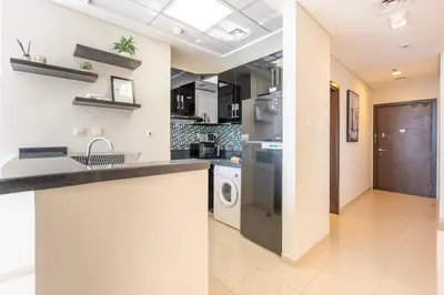 a kitchen with a sink and a dishwasher at Sea and City View 1BR, Close to Marina Beach, Botanica Tower, Dubai Marina by Deluxe Holiday Homes in Dubai