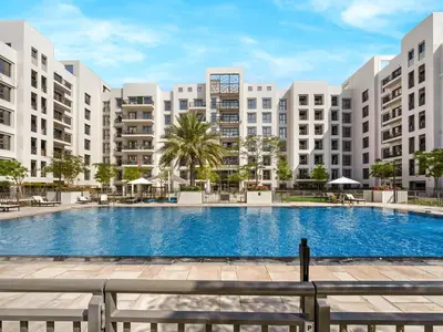 an image of a large swimming pool with buildings at The Town Square Suite Luxury 2BR Near Qudra Lake in Dubai