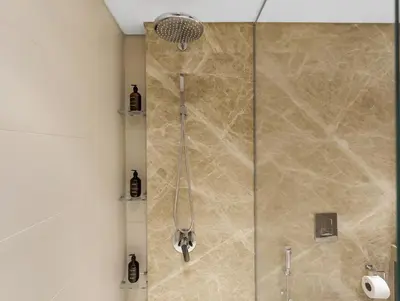 a shower with a glass door in a bathroom at Utra Lux Large 1 BR with Sunset Views and Private Beach in Dubai