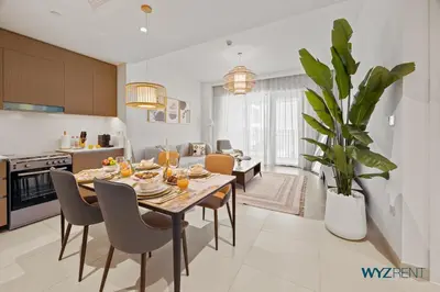 a kitchen and dining room with a table and chairs at Serene 1 BR in Surf 2-Creek Beach Access in Dubai