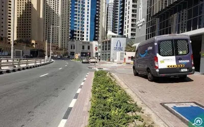 a van parked on the side of a city street at Great Flat Near Marina & Beach With Amazing View, Many Activities in Dubai