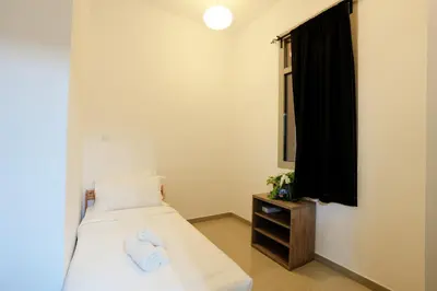 a bedroom with a bed with two towels on it at Great Flat Near Marina & Beach With Amazing View, Many Activities in Dubai
