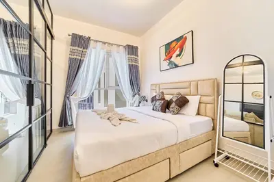 a bedroom with a bed and a window at Modern 1BR Retreat in Dubai Hills Prime Location in Dubai