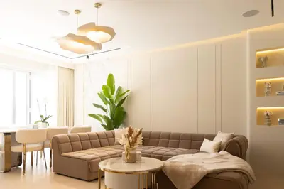 a living room with a couch and a table at Villa Zalex Springs 14 Luxury Living with Private Pool in Dubai