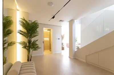a living room with a couch and a palm tree at Villa Zalex Springs 14 Luxury Living with Private Pool in Dubai