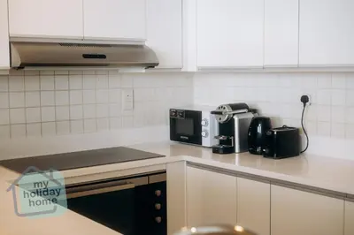 a kitchen counter with a coffee maker and a toaster at Private Beach - Tourist Spot - High Floor Residence in Dubai