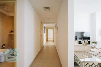 a hallway leading to a living room and a kitchen at Private Beach - Tourist Spot - High Floor Residence in Dubai