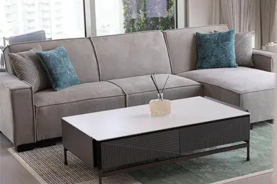 a living room with a couch and a coffee table at Stunning Downtown 4BR Sky High Luxury Apartment with Fountain Views in Dubai