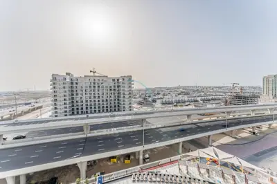 an overhead view of a highway with cars on it at City Views 2BR and Assistant Room with Mini Private Pool in Balcony, Gemz by Danube, Al Furjan by Deluxe Holiday Homes in Dubai
