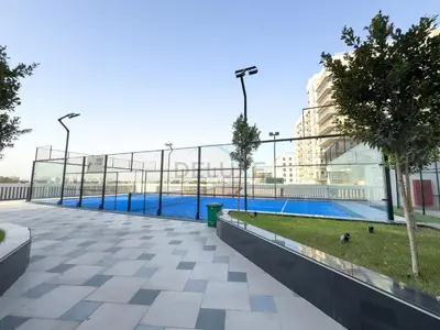 a view of a swimming pool in a building at City Views 2BR and Assistant Room with Mini Private Pool in Balcony, Gemz by Danube, Al Furjan by Deluxe Holiday Homes in Dubai