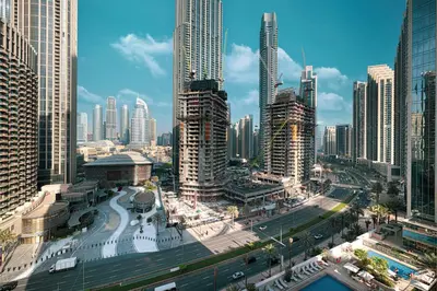 a view of a city with tall buildings at Stay in Modern Elegance 4BR with Pool Gym and Boulevard Views in Dubai
