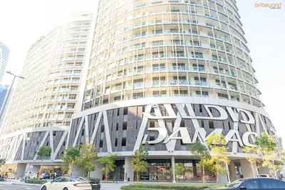 a large building with the words world bank on it at Bnbeyond's Artsy Canal-View Studio in the Heart of BBay in Dubai