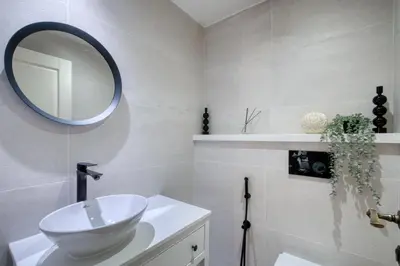 a bathroom with a sink and a mirror on the wall at The Smart Concierge - Rimal 4 in Dubai