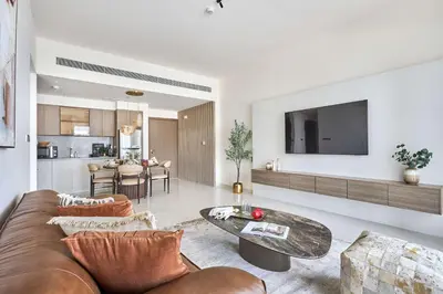 a living room with a couch and a table at Frank Porter - Grand Bleu Tower 2 in Dubai