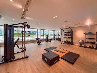 a gym with several exercise equipment in a room at Frank Porter - Grand Bleu Tower 2 in Dubai