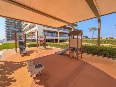 a playground with a slide and a play structure at Frank Porter - Grand Bleu Tower 2 in Dubai
