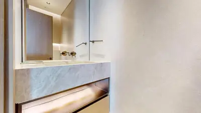 a bathroom with a sink and a mirror at Palm Tower - Luxurious One Bed with Palm View in Dubai