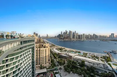 a view of a city with a river and buildings at Seven Palm Residences - Private Beach Access, Infinity Pool with Sea View in Dubai