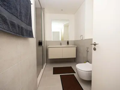 a bathroom with a toilet and a sink at Beach View family friendly unit in Dubai in Dubai