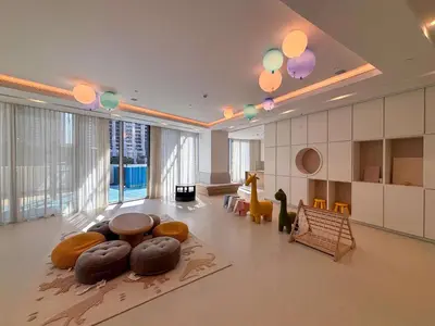 a large living room with a table and chairs at Frank Porter - Grande Signature Residence in Dubai