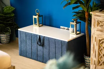 a blue and white counter with two candles on it at Modern Elegance in a Cosy Retreat with Balcony - Azizi Riviera in Dubai