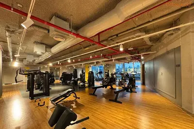 a gym with lots of treadmills and cardio machines at Bnbeyond's Artistic Luxe Retreat with Burj Views in Dubai